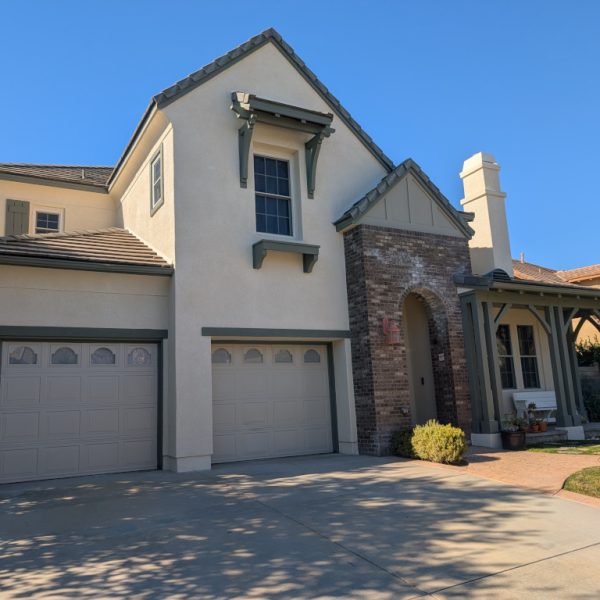 Exterior house painting contractor Paint Daddy providing durable protection for a large stucco home in the Santa Clarita Valley