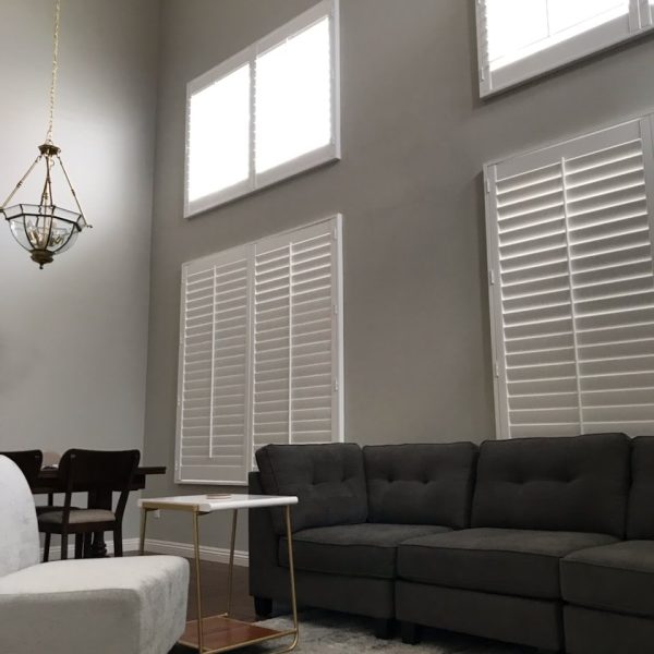 Professional interior painting services by Paint Daddy in a Santa Clarita living room with vaulted ceilings and high walls