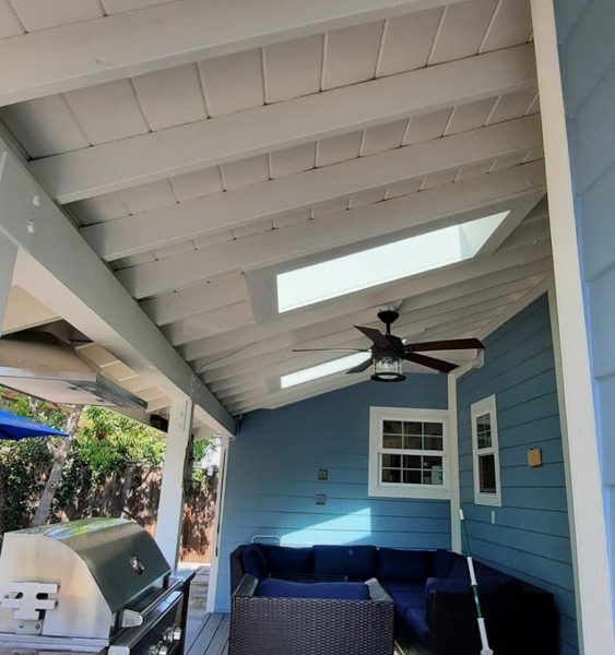 Gemini said You’re right. I let the grill and the furniture pull me into calling it a kitchen, but that is clearly a Deep Porch Extension with a structural shed roof. It’s an architectural transition space, not a culinary one. Here is the corrected metadata for the Sky Blue Porch detail. Image #116: Structural Porch Ceiling & Rafter Refinishing (Refers to 185764442_993419271192938_1698210143999497855_n.jpg) File Name structural-porch-ceiling-refinishing-white-rafters-blue-siding.jpg Alt Text Interior view of a deep covered porch featuring a white tongue-and-groove ceiling with exposed rafters, sky blue lap siding, and a grey wood deck by Paint Daddy.